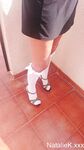 selfshot in short skirt high heels and knee high socks