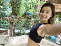 Melena Maria Rya with parrots