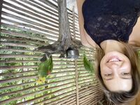 Melena Maria Rya with parrots