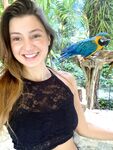 Melena Maria Rya with parrots