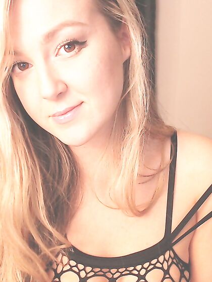 Blonde In Fishnet Craving Carmen Is Flashing Shaved Nub Slit And Fingering It
