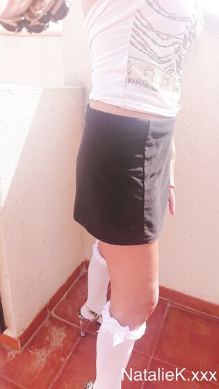 selfshot in short skirt high heels and knee high socks