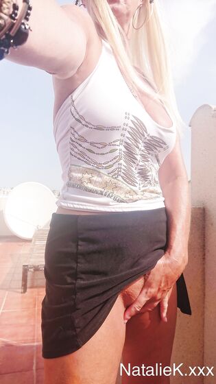selfshot in short skirt high heels and knee high socks
