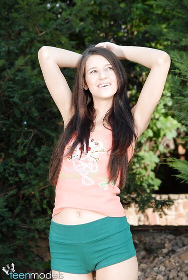 Teenie Yulia Bright Fills Her Bald Pussy With Dildos After Taking Off Her Shorts In The Garden