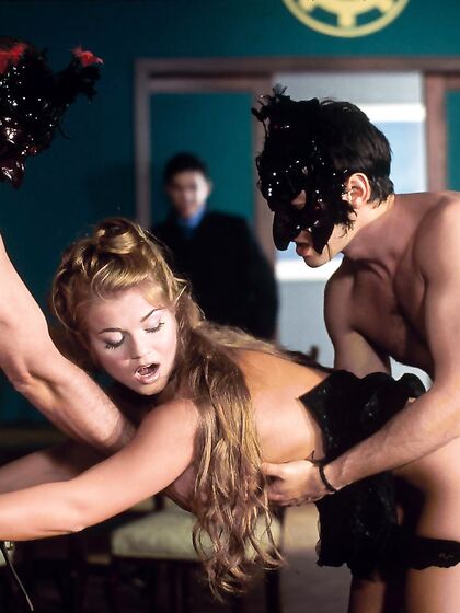 Hot Well Stacked Lady Rita Faltoyano Gets Tag Teamed By Two Horny Masked Men