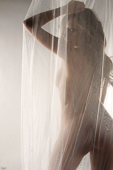 Arousing Lily Xo Loves Teasing With Her Naked Hot Body Behind The Curtain
