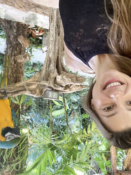 Melena Maria Rya with parrots
