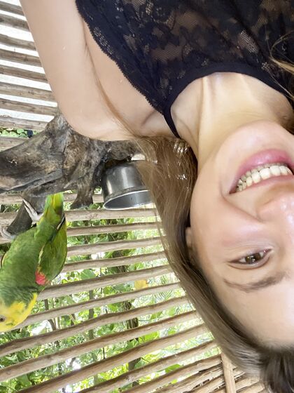 Melena Maria Rya with parrots