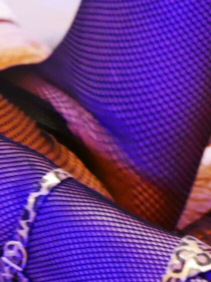 Stilettoes and fishnets in electic blue lightsÂ 