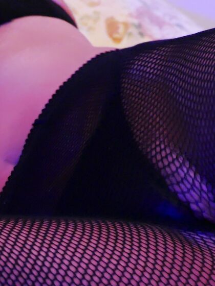 Stilettoes and fishnets in electic blue lightsÂ 