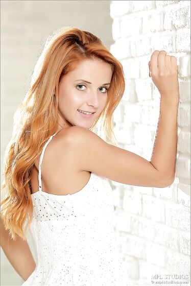 Slim Tanned Ginger Babe In White Dress Roberta Berti Strips For The Camera