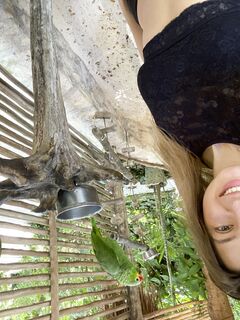 Melena Maria Rya with parrots