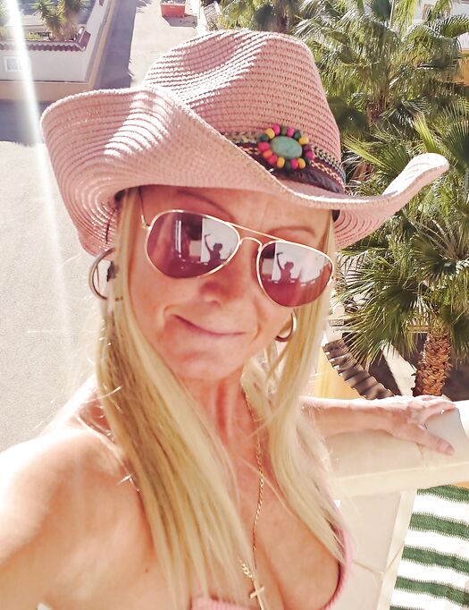 fingering outside on my balcony in pink bikini top and cowgirl hat