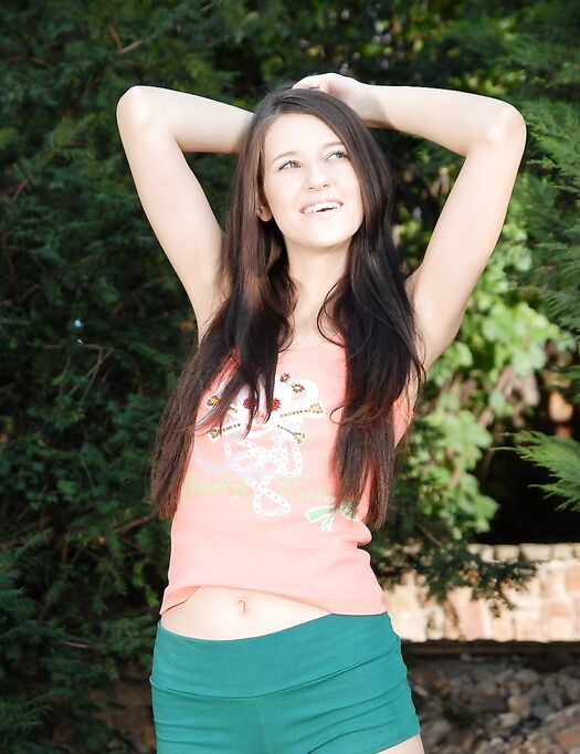 Teenie Yulia Bright Fills Her Bald Pussy With Dildos After Taking Off Her Shorts In The Garden